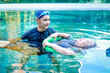 © SUPERMAO - Asian man or physiotherapist helping elderly female patient with hydrotherapy It is a rehabilitation and exercise in the water. physical therapy center