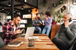 © Pintau Studio - Group of casual people working in a modern office.