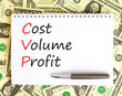 © Dzmitry - CVP cost volume profit symbol. Concept words CVP cost volume profit on white note on beautiful background from dollar bills. Pen. Business and CVP cost volume profit concept. Copy space.