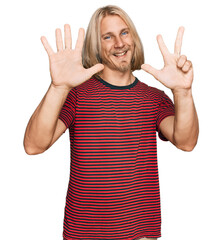 Canvas Print - Caucasian man with blond long hair wearing casual striped t shirt showing and pointing up with fingers number eight while smiling confident and happy.