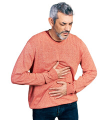 Sticker - Middle age hispanic with grey hair wearing casual sweater with hand on stomach because indigestion, painful illness feeling unwell. ache concept.