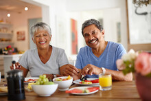 Getting A Healthy Start To The Day. Shot Of A Happy Senior Couple Enjoying A Leisurely Breakfast Together At Home.