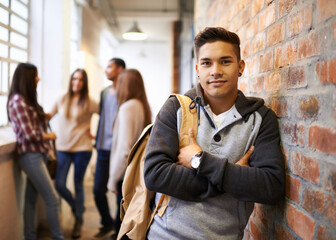 Aufkleber - Friends make college fun. Portrait of a handsome young male student leaning against a wall with his friends in the background.