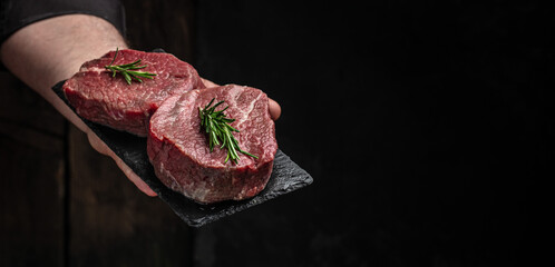 Poster - Beef medallions with rosemary and spices, Raw beef meat steak Tenderloin fillet on a dark background. banner, menu, recipe place for text, top view