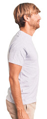 Poster - handsome caucasian man with beard wearing casual tshirt looking to side, relax profile pose with nat