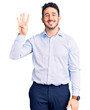 © Krakenimages.com - Young hispanic man wearing business clothes showing and pointing up with fingers number four while smiling confident and happy.