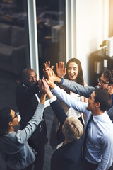 Poster - Were going to succeed no matter what. Shot of a group of businesspeople high fiving in an office.