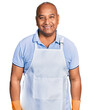 © Krakenimages.com - Hispanic middle age man wearing cleaner apron and gloves looking positive and happy standing and smiling with a confident smile showing teeth