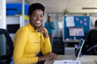 © Wavebreak Media - Portrait of african american businesswoman using laptop and smiling at office