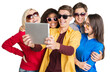 © BillionPhotos.com - summer holidays, teenage and technology concept - group of smiling teenagers in sunglasses taking picture with tablet pc