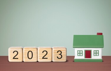 Poster - Property concept. House model and cubes with number 2023