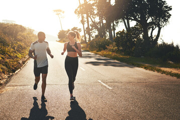 Aufkleber - Getting the blood flowing with a workout buddy. Shot of a fit young couple going for a run outdoors.