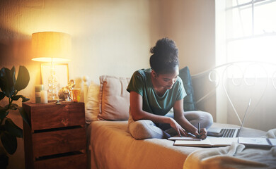 Poster - Shes a diligent student. Full length shot of a young female student studying at home.
