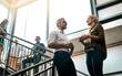 © Viglietti/peopleimages.com - Great ideas come from casual conversations. Shot of two businesspeople talking to each other while standing on a stairwell.