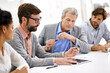 © Yuri A/peopleimages.com - Hard working office pros. Shot of a group of young professionals working at a desk in an office.