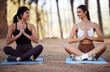 © Joanrae P/peopleimages.com - Yoga, outdoor meditation and women exercise in nature for fitness, peace and wellness. Happy people or friends smile on forest ground for zen workout, training and energy for mental health and chakra