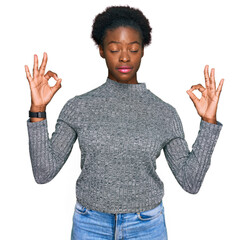 Sticker - Young african american girl wearing casual clothes relax and smiling with eyes closed doing meditation gesture with fingers. yoga concept.