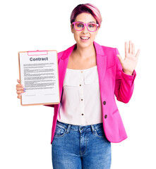 Poster - Young beautiful woman with pink hair holding clipboard with contract document waiving saying hello happy and smiling, friendly welcome gesture