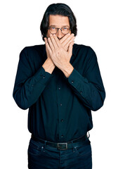 Poster - Middle age caucasian man wearing casual clothes and glasses shocked covering mouth with hands for mistake. secret concept.