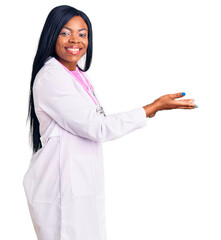 Poster - Young african american woman wearing doctor stethoscope pointing aside with hands open palms showing copy space, presenting advertisement smiling excited happy