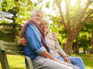 Wall Mural - Old couple hug in portrait, relax in the park with smile, happiness together with bonding in nature, love and retirement. Happy, man and woman with travel, relationship with marriage and commitment