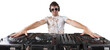 © BillionPhotos.com - Portrait of confident young DJ with headphones on head mixing music on mixer