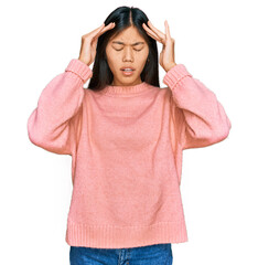 Sticker - Beautiful young asian woman wearing casual winter sweater with hand on head for pain in head because stress. suffering migraine.