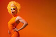 Drag queen posing over orange background studio shot with copy space for advertisement or text. Generative AI
