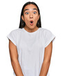 © Krakenimages.com - Young asian woman wearing casual white t shirt afraid and shocked with surprise expression, fear and excited face.