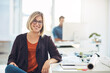 © Laflor/peopleimages.com - My career keeps me smiling everyday. Portrait of a young woman working at her desk in a modern office.