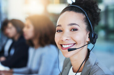 Wall Mural - call us and well provide the solution. portrait of a young woman working in a call centre.