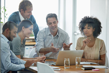 Aufkleber - Brainstorming doesnt have to be boring. Shot of a group of professionals using wireless technology during a meeting.