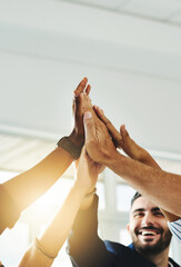 Aufkleber - Motivated more than ever before. Cropped shot of a group of businesspeople high fiving in an office.