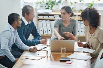 Aufkleber - Heres what I think this website needs. Shot of a group of professionals using wireless technology during a meeting.