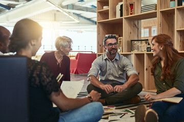 Aufkleber - I like this business environment we have. Cropped shot of a group of business colleagues in the office sitting on the floor and discussing ideas.