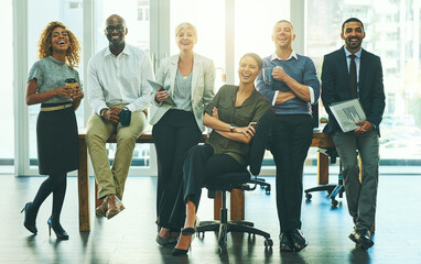 Poster - Taking strides towards success as a team. Portrait of a group of businesspeople in an office.