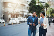 © Donson/peopleimages.com - These two go-getters stay on the move. Shot of two businesspeople having a discussion while walking in the city.