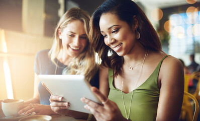 Poster - Our coffee dates are wherever we get free wifi. Cropped shot of girlfriends sharing something on a digital tablet while sitting in a cafe.