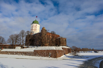 old medieval castle in Vyborg, Russia with the white tower, winter view