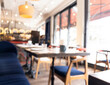 © Aleksei - Cafe restaurant interior with customer and wood table blur abstract background with bokeh light.