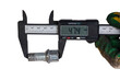 Measuring the length of the bolt with an electronic caliper. Tools and industry.