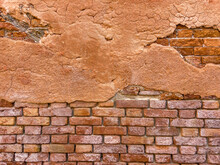 Faint Brown Painting Remnant On The Brick Wall Of An Old Building. Wall Background In Design Loft Style. Grunge Reddish Brown Colored With Copy Space. Partly Damaged Blank Poster Surface Template. 