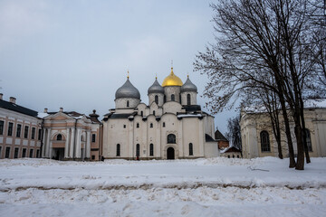 Wall Mural - old stone church in the old center in Veliky Novgorod on a winter day