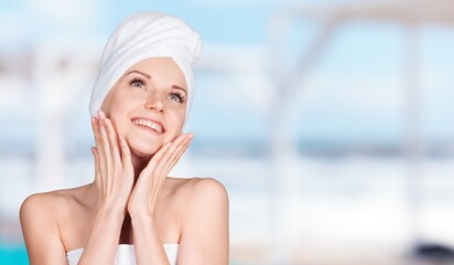 Wall Mural - Happy young woman after facial treatment.