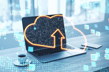 Wall Mural - Cloud computing technology and data transfer concept with glowing virtual cloud symbol with arrow inside on modern laptop background on office table, double exposure