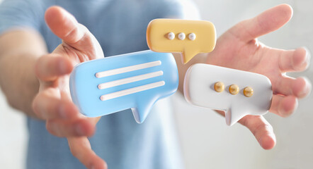 Wall Mural - Businessman holding digital speech bubbles talk icons. Minimal conversation or social media messages floating between man hands. 3D rendering