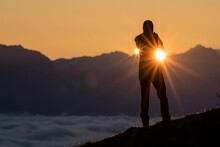 Silhouette Of Person Standing Against Sun At Sunrise Near Geneva Lake, Gingins, Vaud, Switzerland