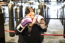 A Female Boxer Shadow Boxing While Training At The Gym.