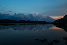 Two People Watching The Sunset On The Mont Blanc Range From The Lac Des Cheserys