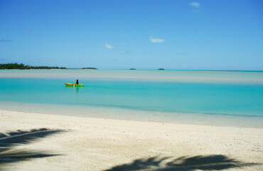 Canvas Print - Kayaker paddles along in idyllic tropical lagoon